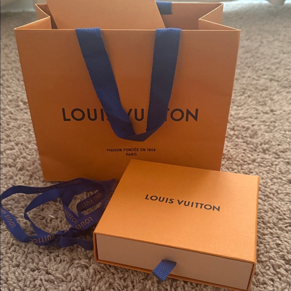 Authentic LV box and bag. Originally came with duffel strap.